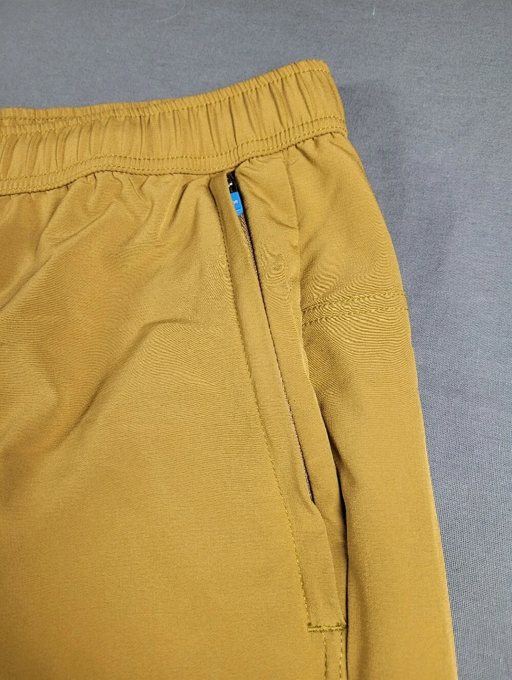 Janji Running Trail Shorts XL Golden Tan Zip Pockets Stretch Activewear